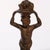 An antique Neoclassical set of figural fireplace andirons offers wrought and cast iron construction with young boy...
