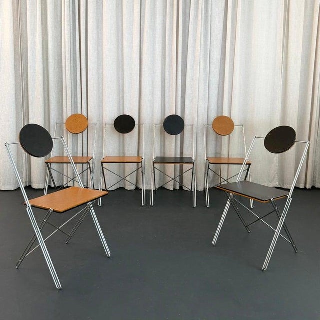 This rare set of six R.J.C. folding chairs by René-Jean Caillette represents the absolute pinnacle of French post-modern...