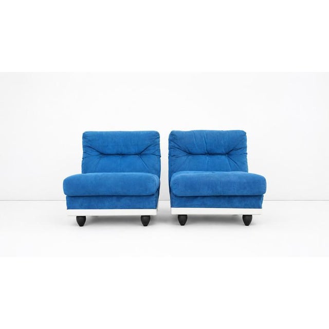Pair of lounge chairs produced in 1970’s, Italy. Fibreglass frame with blue Alcantara upholstery cushions.Condition Fair,...