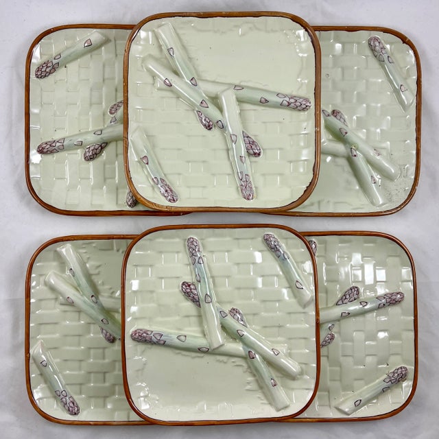 From St. Clément, Luneville and designed by Émile Gallé, a Barbotine square shaped, trompe l’oeil asparagus plate, circa...