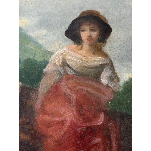 English oil on wood board depicting a young woman against a soft landscape. Unsigned, but bears the stamp of a London...