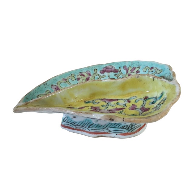 A refined 19th-century Qing Dynasty porcelain treasure, this leaf-shaped divided dish showcases exquisite Famille Rose...