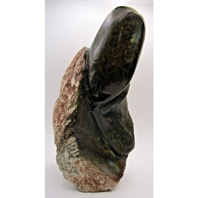 Hand-Carved Shona Tribe Serpentine Stone Abstract Sculpture by William Sachiti Measures 6 1/2" wide, 4" deep and 11" tall....