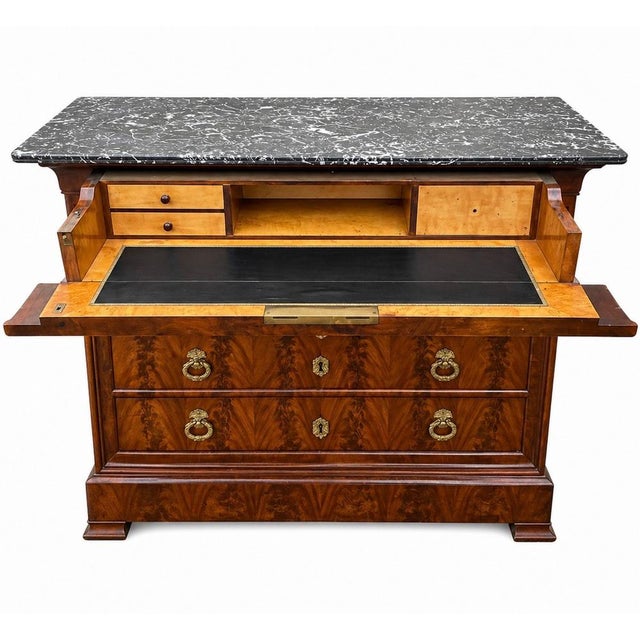 A very beautiful 19th-century Louis Philippe walnut chest of drawers and secretary desk with attractive veneer. It...