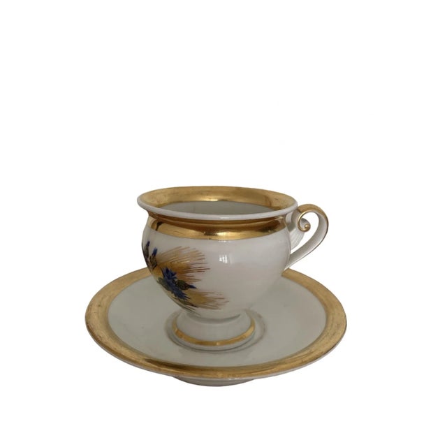 Royal Copenhagen Empire Style Porcelain Cup with Saucer with Floral and Gilded Decor. First half of the 19th century....