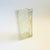 A unique vintage vase made from a glass block. A rounded rectangular opening has been cut into the top for use as a vase....