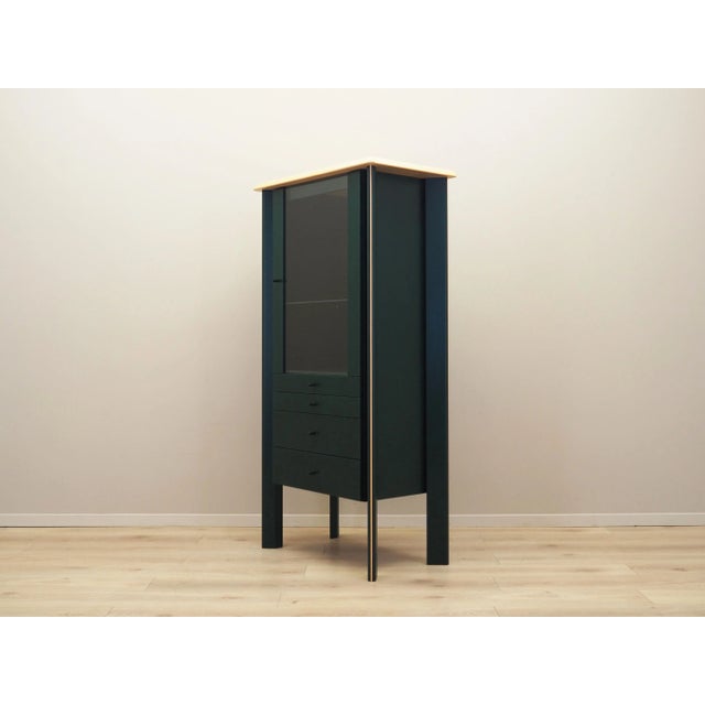 The showcase was made in the 1980s, Danish production. The structure is covered with oak veneer stained green. The top is...