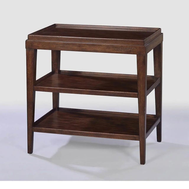 A Classic style rustic country wood-tone side table with a galleries dish top, the finish with natural highlights, time-...