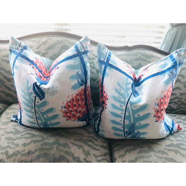 Two 23” x 23” artisan made pillow covers in Thibaut’s Triverton in Coral accented with royal blue trim. We chose...
