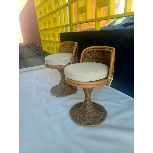 Lovely pair of vintage Swivel Vanity Stools made of Rattan and Cane in Hong Kong. Swivel perfectly and come with seat...