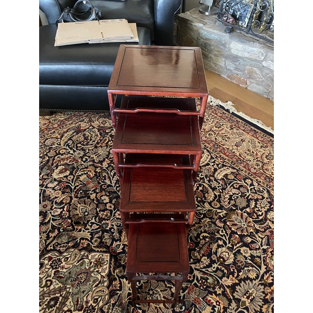 Beautiful set of 4 Chinese rosewood nesting tables exhibiting its simple lines in Ming style. Each table is completely...