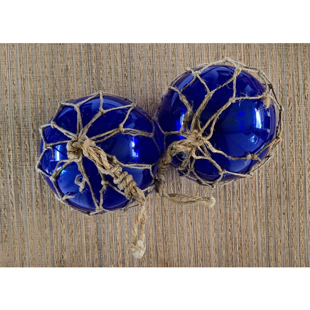 Glass Vintage Pair of Rare 8" Cobalt Blue Hand-Blown Glass Fishing Floats · Original Jute Net For Sale - Image 7 of 7