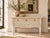 Geometric carving covers the drawer fronts and the shaped apron of this console, star and leaf patterns cut deep enough to...