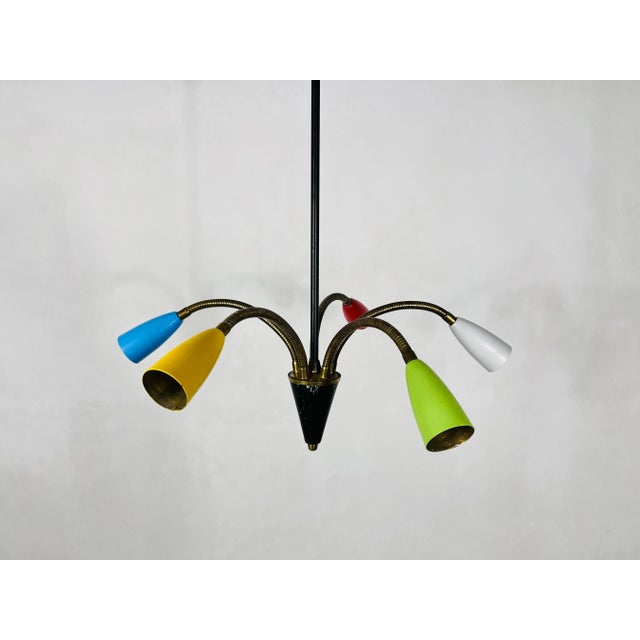 A colorful Sputnik chandelier made in Italy in the 1950s. It is fascinating with its five flexible brass arms, each of it...