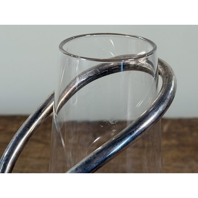 Italian modernist silverplate wine carafe by G.B. Sport Padova, featuring a clear cylindrical glass body set into a...