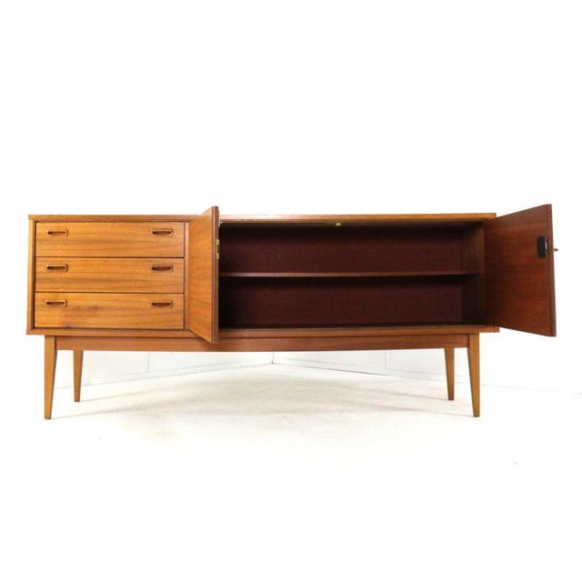 This beautiful sideboard is a stunning and timeless piece of furniture that hails directly from the golden age of Mid-...