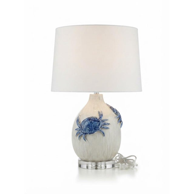 Handcrafted in Italy, this striking vintage coastal table lamp features a ceramic base textured with delicate vertical...