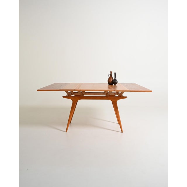 Teak frame and top. Height-adjustable and extendable top. Made by Tingströms, Sweden, 1960s. Transforming table made by...