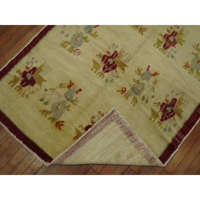 One of a kind, mid-20th century ivory field Turkish floral rug.