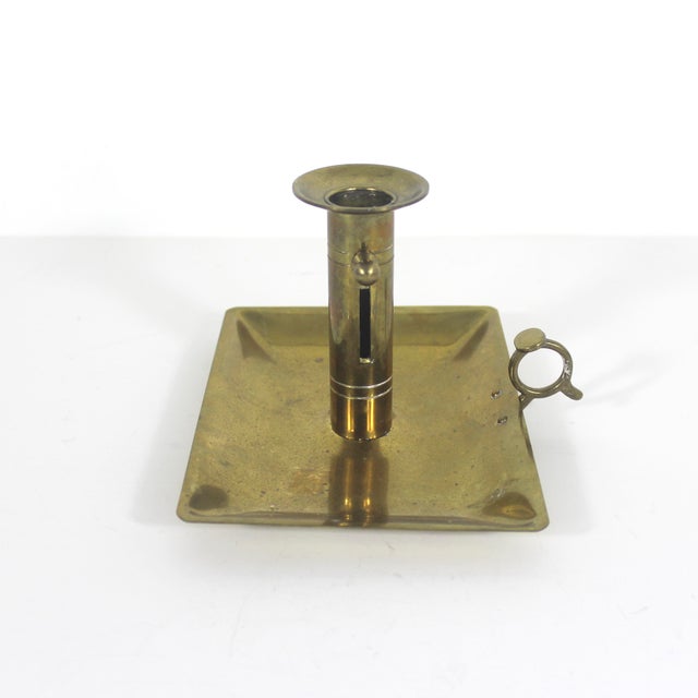Single solid brass push up candle holder with a knob on the side to adjust the height of the candle. This holds a standard...