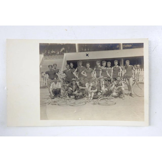 Circa 1910 gelatin silver photograph of a group of bicycle racers. Looks like they are in a stadium, good condition X in...