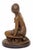 This 20th century Art Deco bronze sculpture in brown patinated bronze represents a seated female nude figure, modeled with...