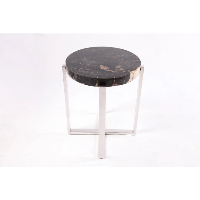 The top of this modern accent side table is made of one slice of organic petrified wood, hand polished to show its...