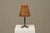 Mid century table lamp in wrought iron with woven rattan shade 1960s a characterful mid-century table lamp in wrought iron...