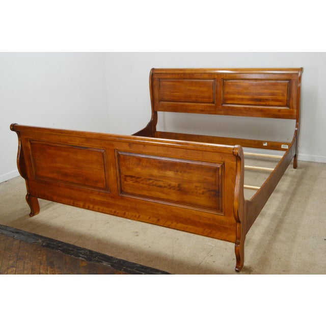 California King Bed by Ethan Allen. Store item #541. I features solid wood construction and comes with slats.