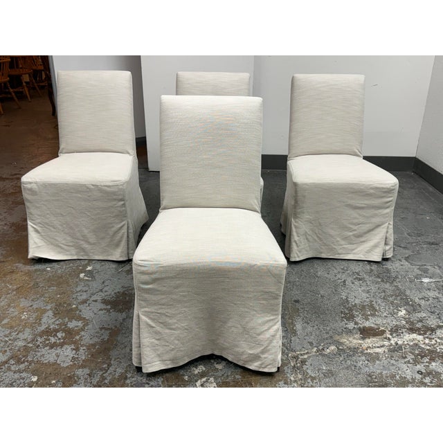 Design Plus Gallery presents a Set of Four Addison Slipcovered Chairs from Crate & Barrel. The chairs are armless and have...