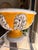 Add a vibrant pop of color to your home with this stylish ceramic planter, featuring a warm golden-yellow glaze and an...