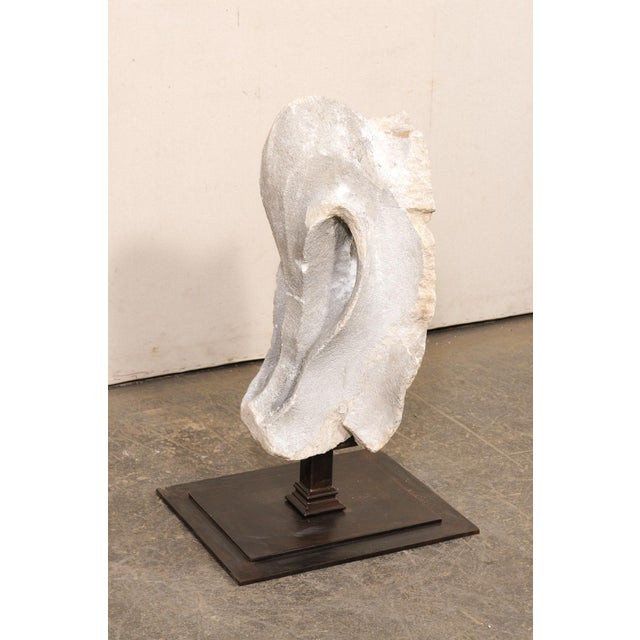 A European carved-limestone cathedral fragment from the 18th century, possibly older. This antique fragment has been hand-...