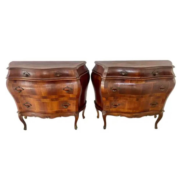 Pair of Italian, Venetian, Walnut Bombé Commodes with dramatic serpentine fronts and sides. The Bombé commode emerged in...