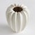 With a sculpted body and thickly applied glaze, this coastalinspired vase is a work of art. The handfinished details give...