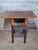 A charming drop-leaf work or sewing table in solid walnut, likely dating from the mid-19th century, in the tradition of...