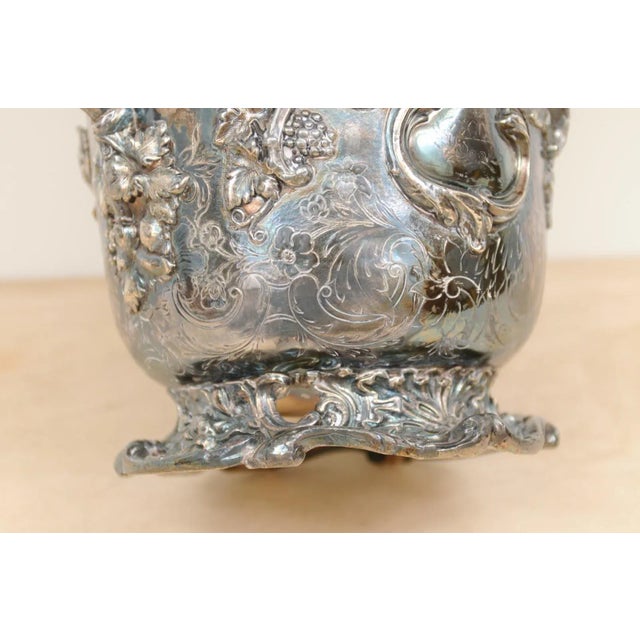 An English George III period Sheffield silver on copper champagne bucket from the early 19th century, with grape motifs....