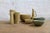 Brown / green collection of 8 vases and bowls from Rörstrand Sweden, designed by Gunnar Nylund in the 1950s. This...