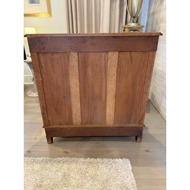Gorgeous antique French provincial walnut cabinet with parquetry doors, graceful curved lines and intricately carved...