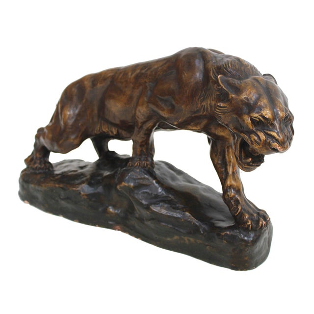 An impressive sculpture of Thomas François Cartier (1879-1943), of a lioness, roaring. The sculpture is made of bronze...
