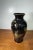 Beautiful vintage Japanese hand painted vase featuring a black gloss finish with floral and butterfly design accents and...