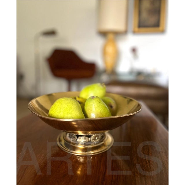 Add a Swedish Art Deco flair to your tabletop with this classic and elegant brass pedestal bowl from the 1940s. The bowl...