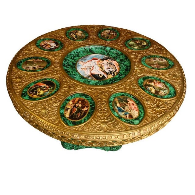 A striking and highly decorative french centre table in the opulent napoleon iii style, combining rich faux malachite...