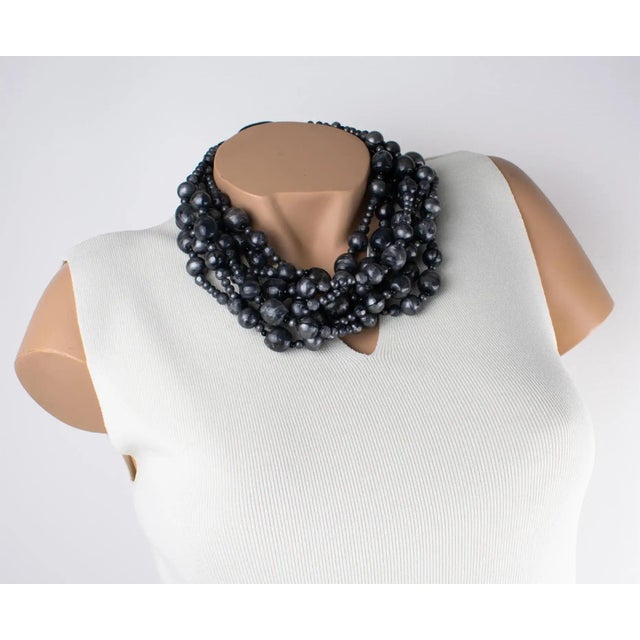 This stunning Angela Caputi resin choker beaded necklace, made in Italy, features a multi-strand design with assorted-...