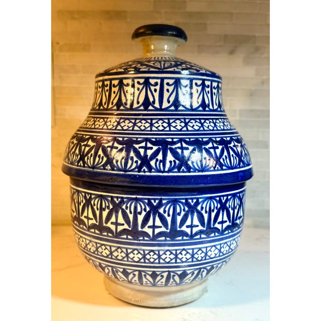 Antique Moroccan Fassi pottery jar featuring intricate, hand-painted geometric and floral designs. Excellent Condition...