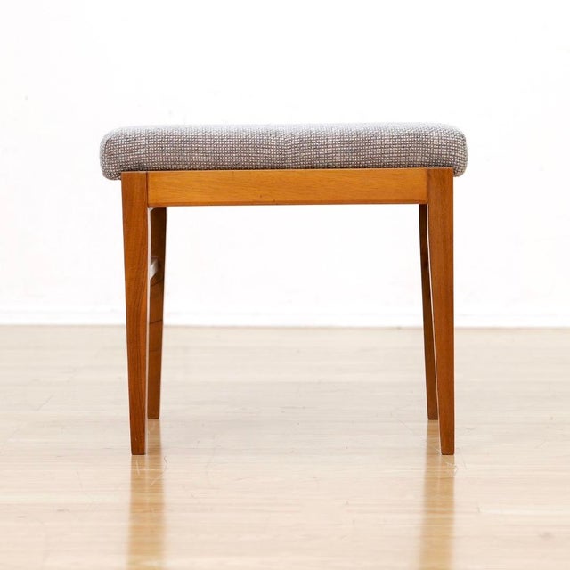 This vintage mid-century vanity stool was produced during the 1960s. The stool is typical of mid-century craftsmanship...