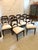 A superb antique set of 10 English Regency carved mahogany dining chairs with elegant shaped backs, finely carved scroll...