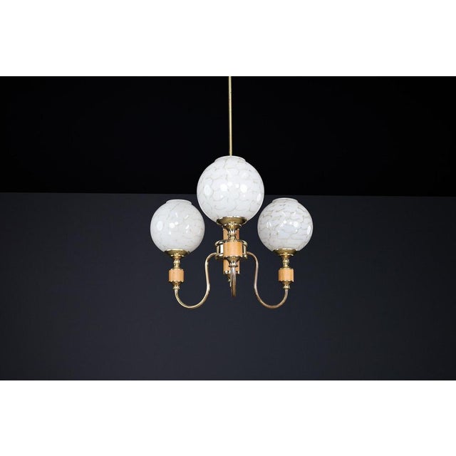 This elegant mid-century modern chandelier, produced in Czechoslovakia during the 1970s, embodies the era's signature...