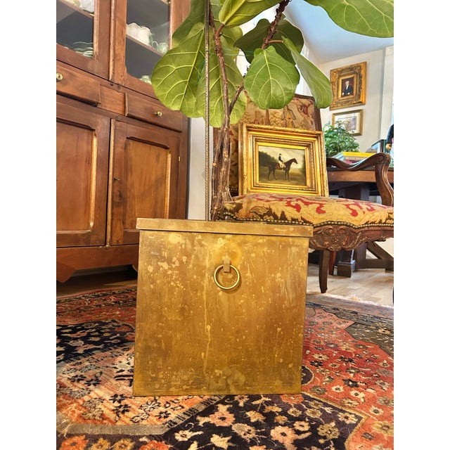This large-scale vintage brass jardinière or cachepot dates to approximately the 1970s. Constructed in an architectural...