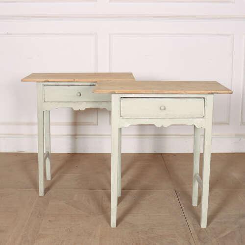 Interesting pair of 19th century English one drawer pine lamp tables/ bed side tables. This piece is designed in the style...