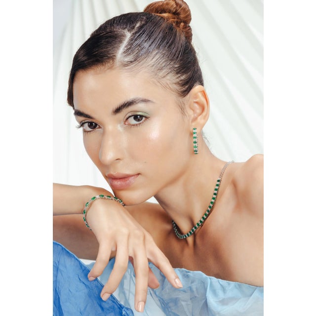 Natural Emerald and Diamond Hoop Earrings in 18K Gold to make a statement with your look. You shall need hoop earrings to...
